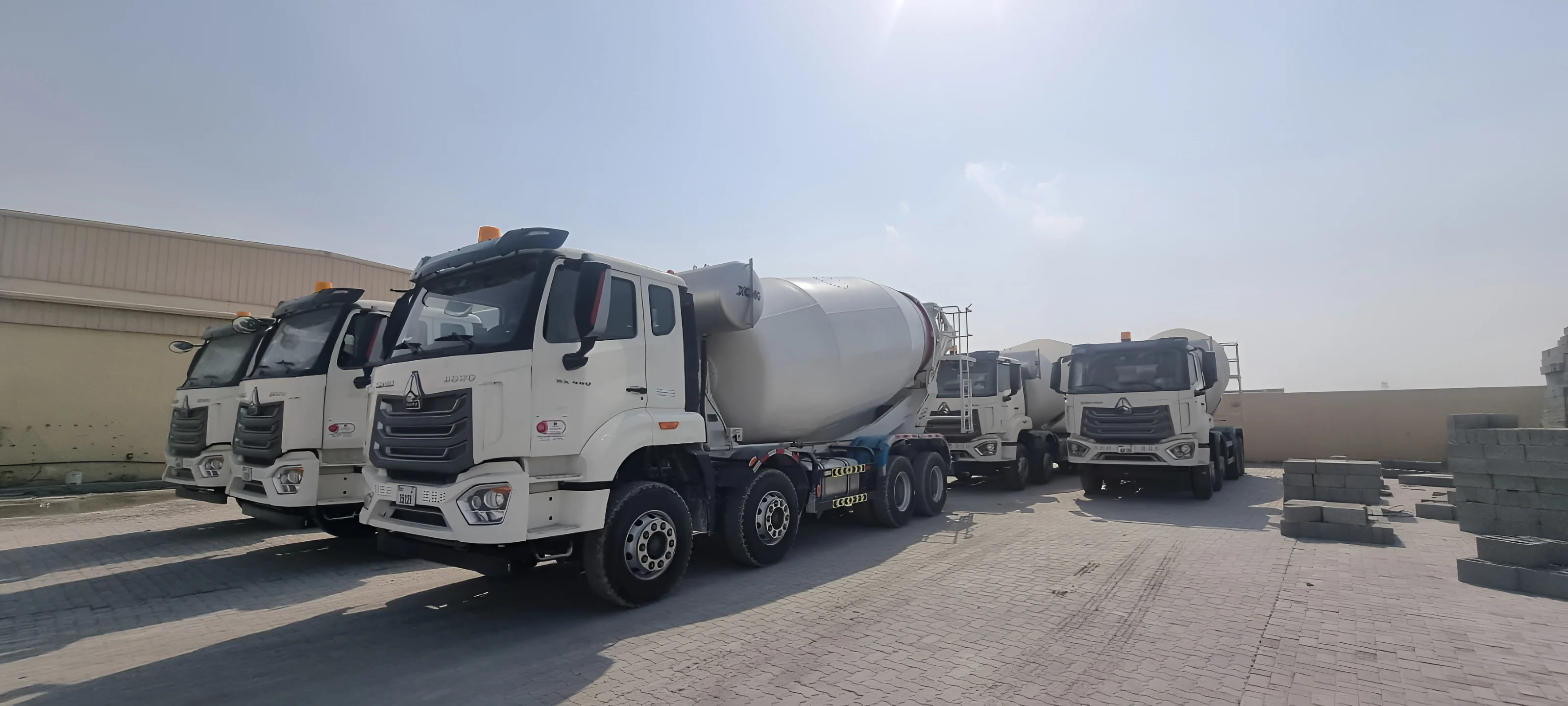 Solid Mix ready-mix concrete mixer trucks lined up at the facility